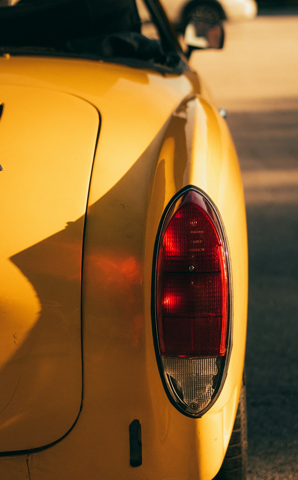 the back of a yellow car