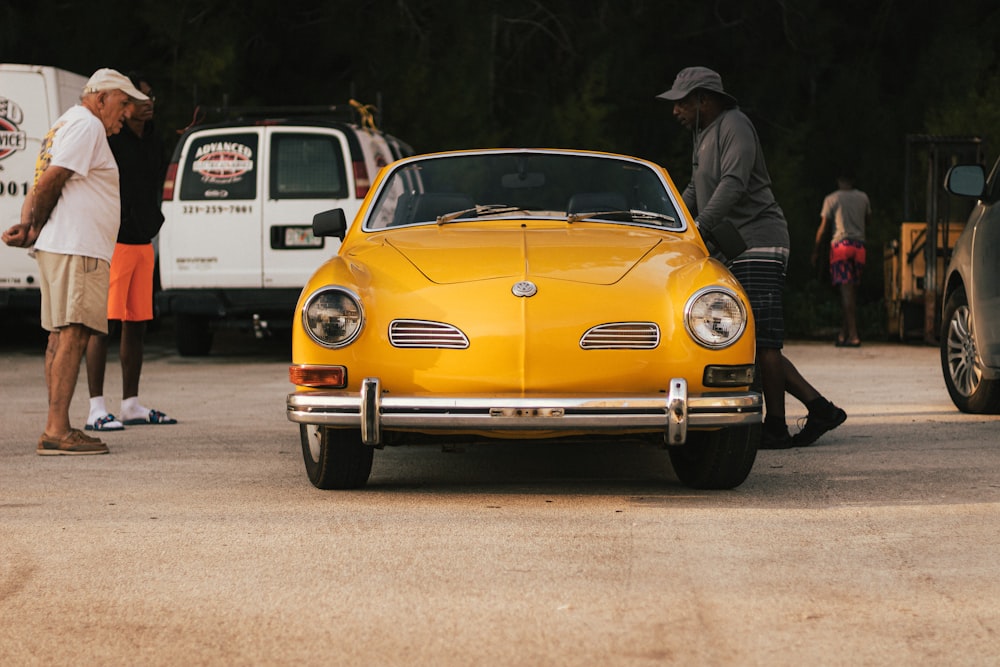 a yellow car parked on a road