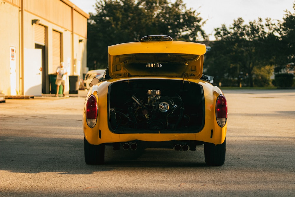 a yellow car parked on a street