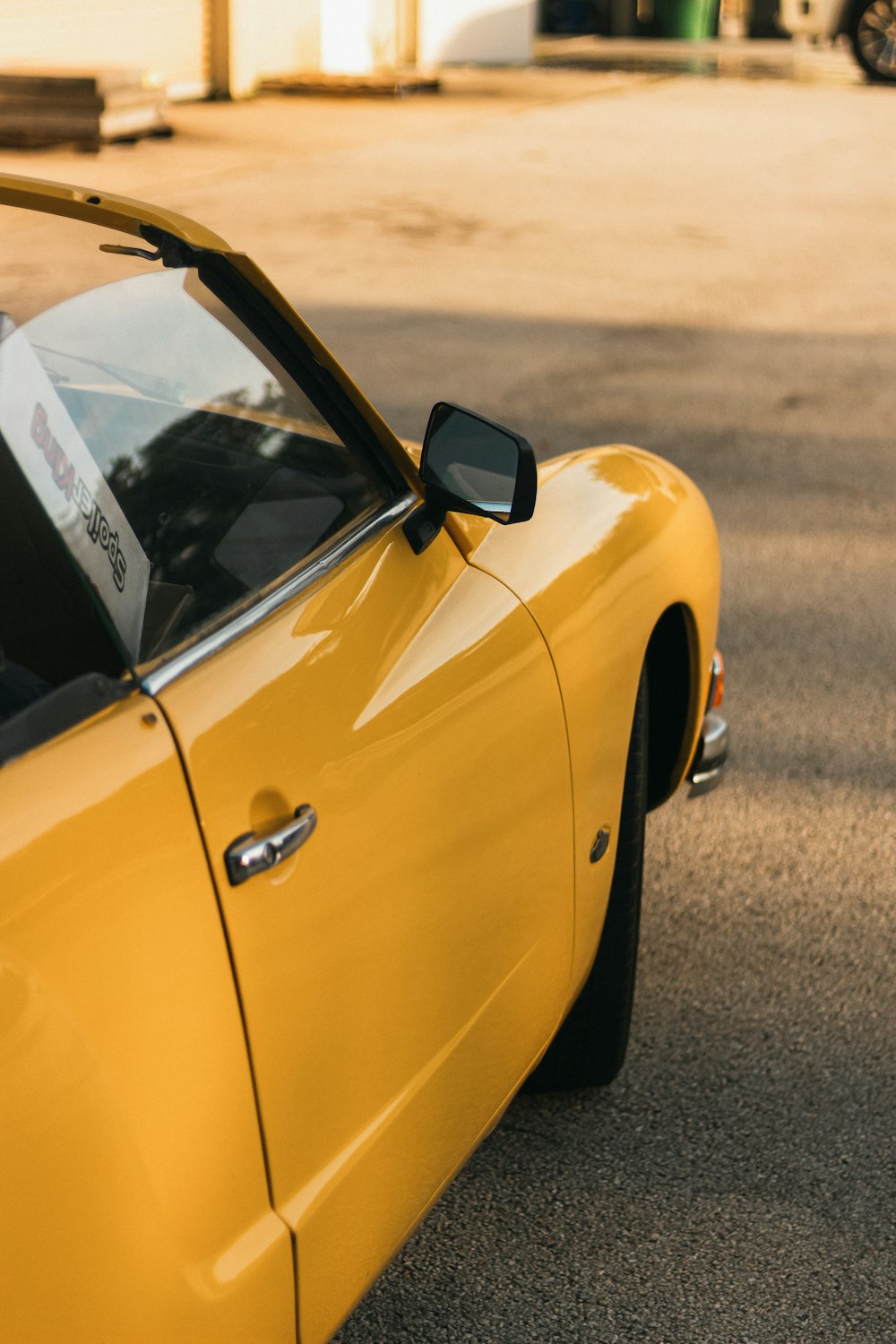 a yellow car parked on a street