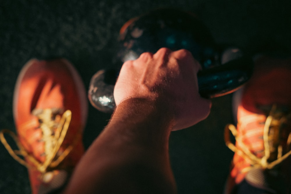 a close-up of a hand holding a light bulb