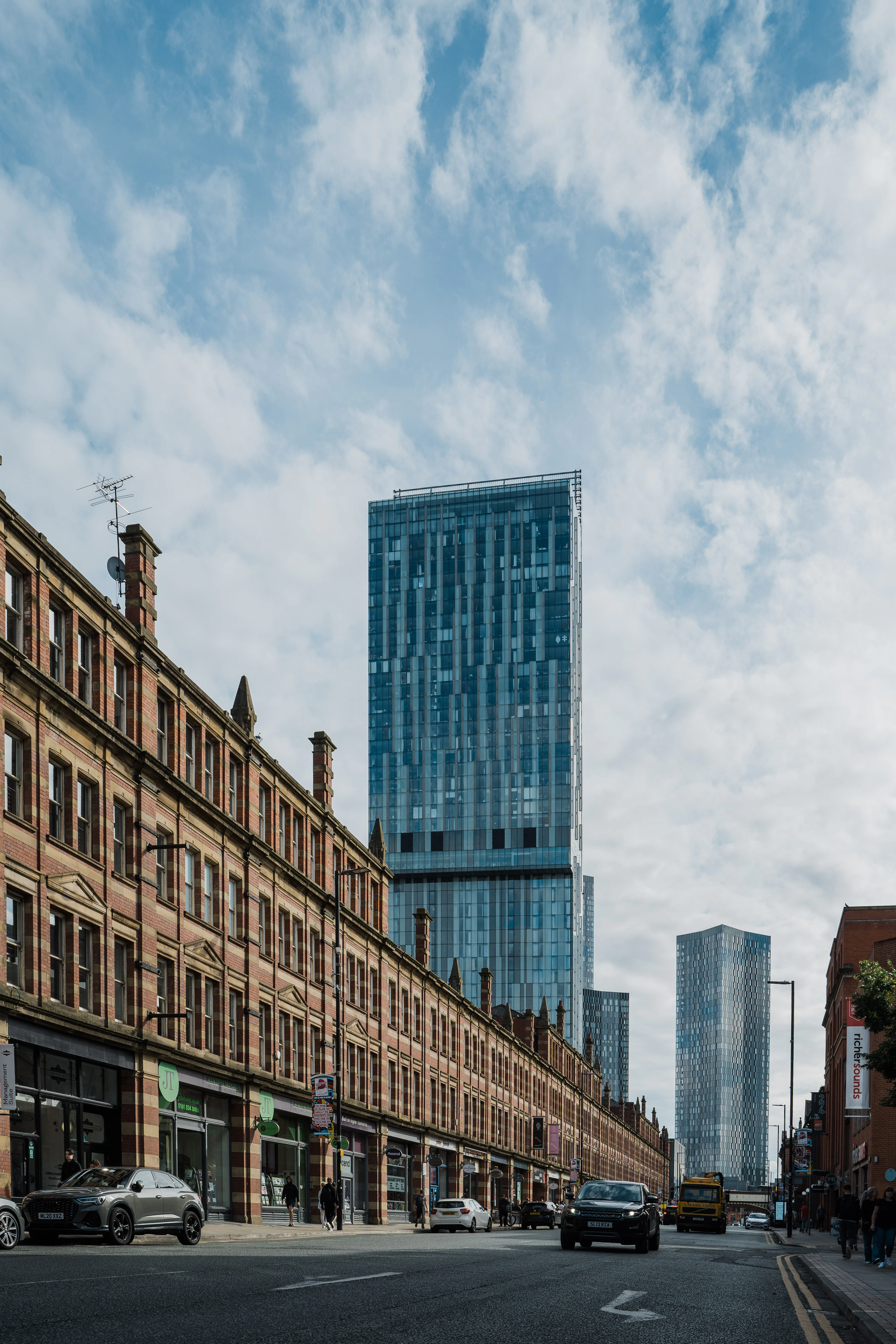 A Victorian street beneath the Deansgate Square towers, Manchester