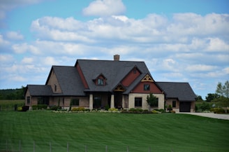a large house with a lawn in front of it