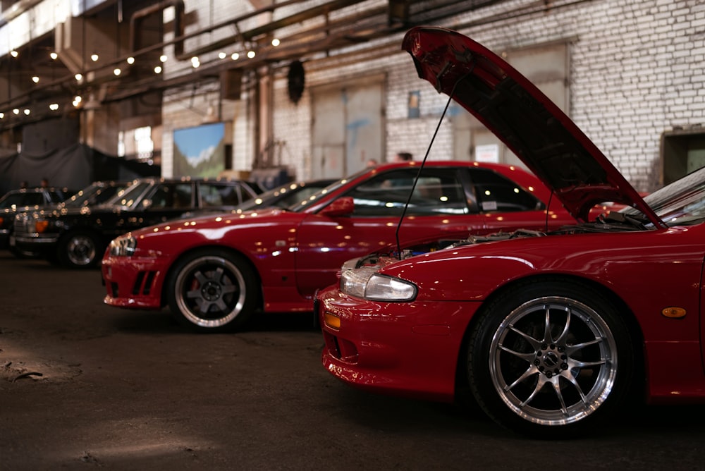 a red car with the hood up