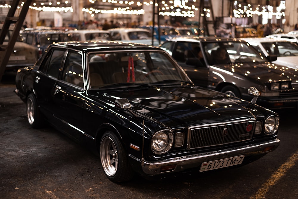 a black car parked in a parking lot