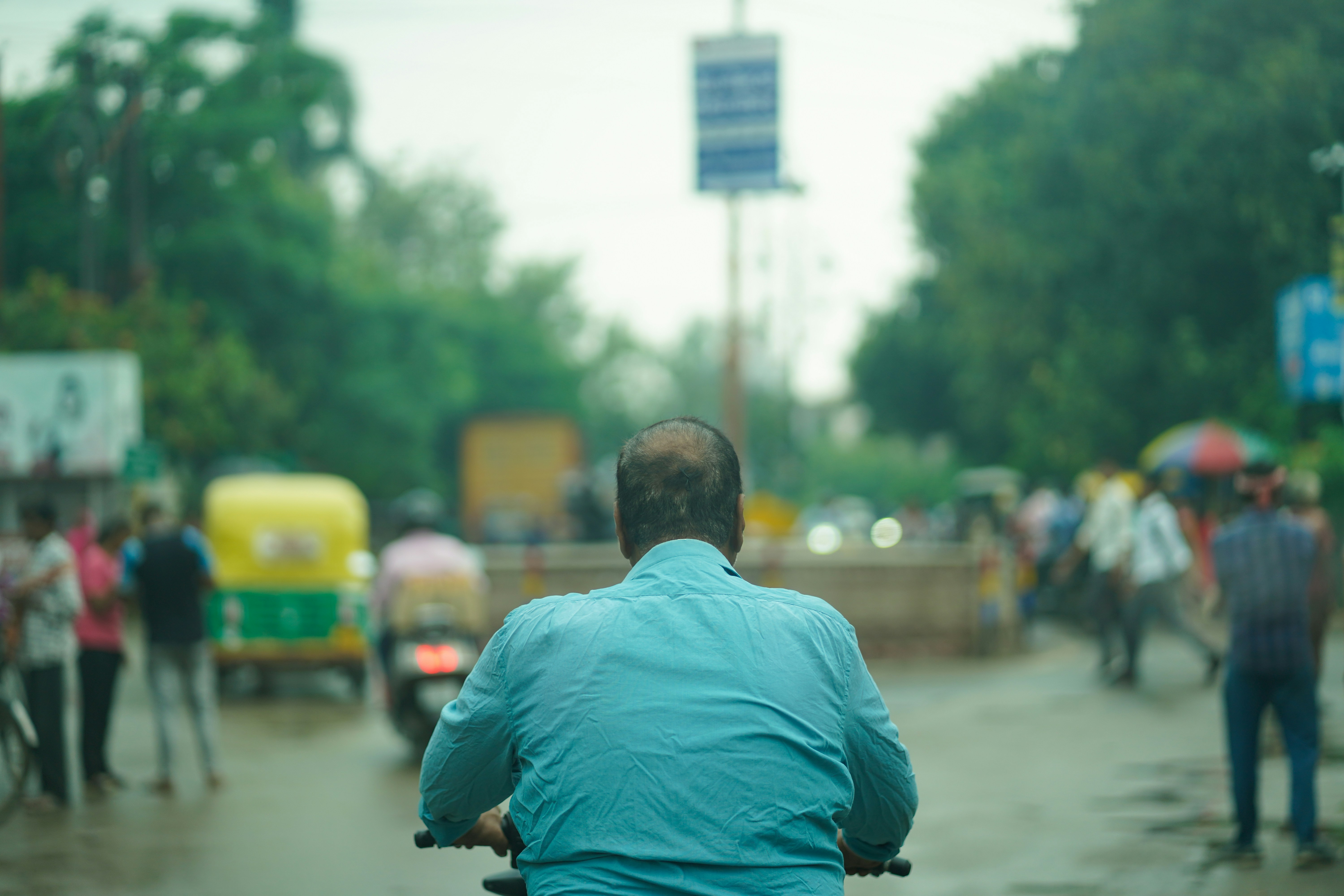 a person riding a bicycle on a busy street