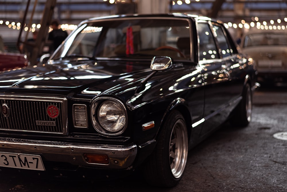 a black car parked in a parking lot