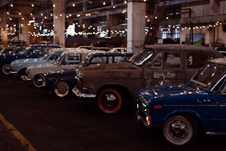a group of cars parked in a parking lot