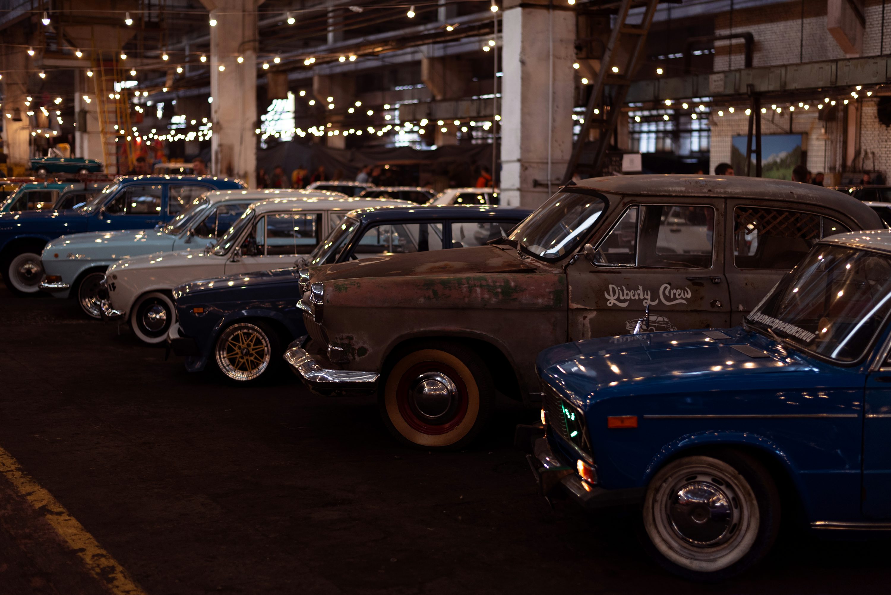 a group of cars parked in a parking lot