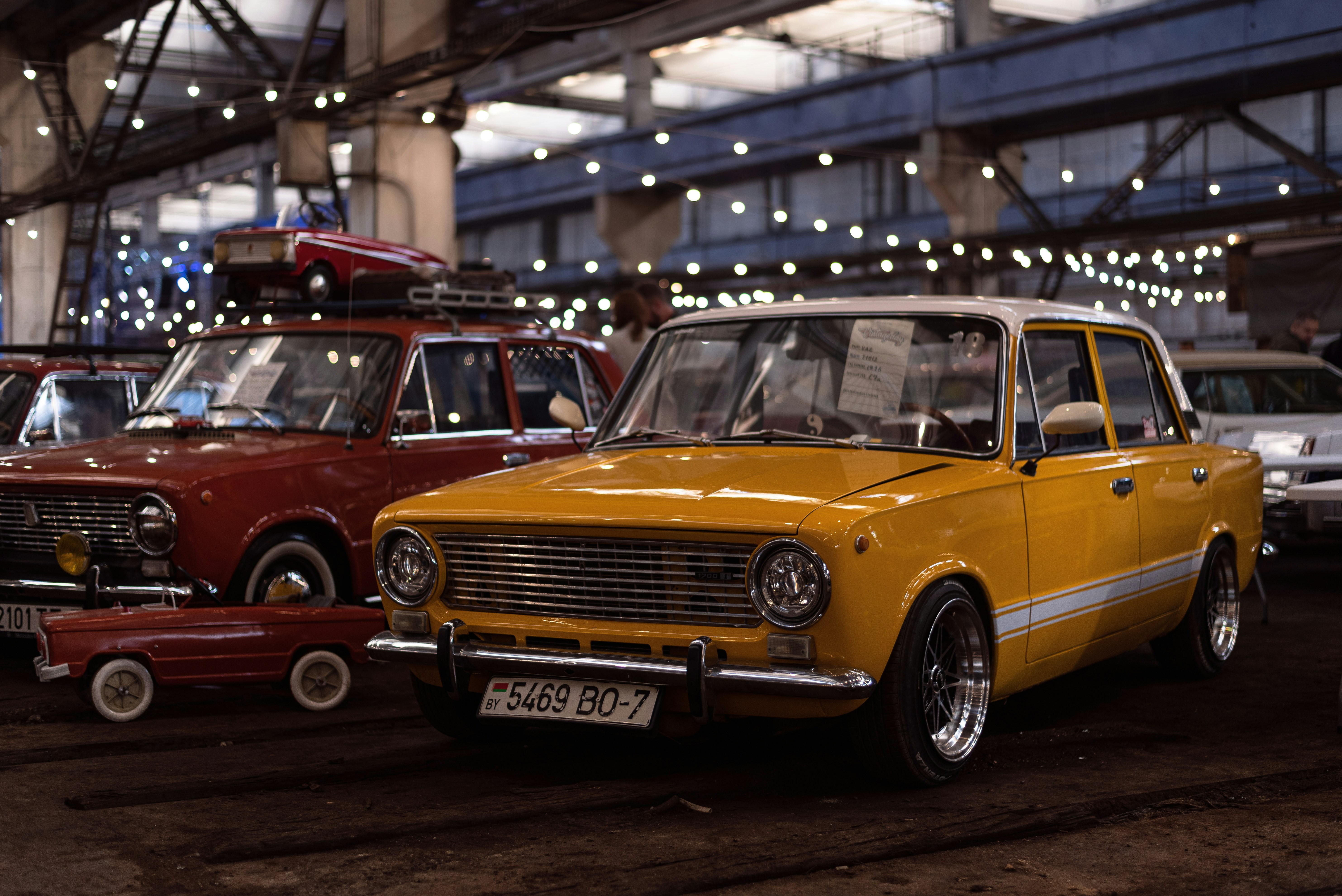 a group of cars parked in a building