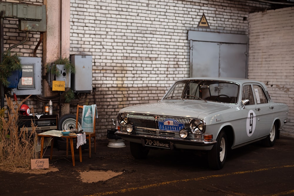 a car parked in front of a brick building