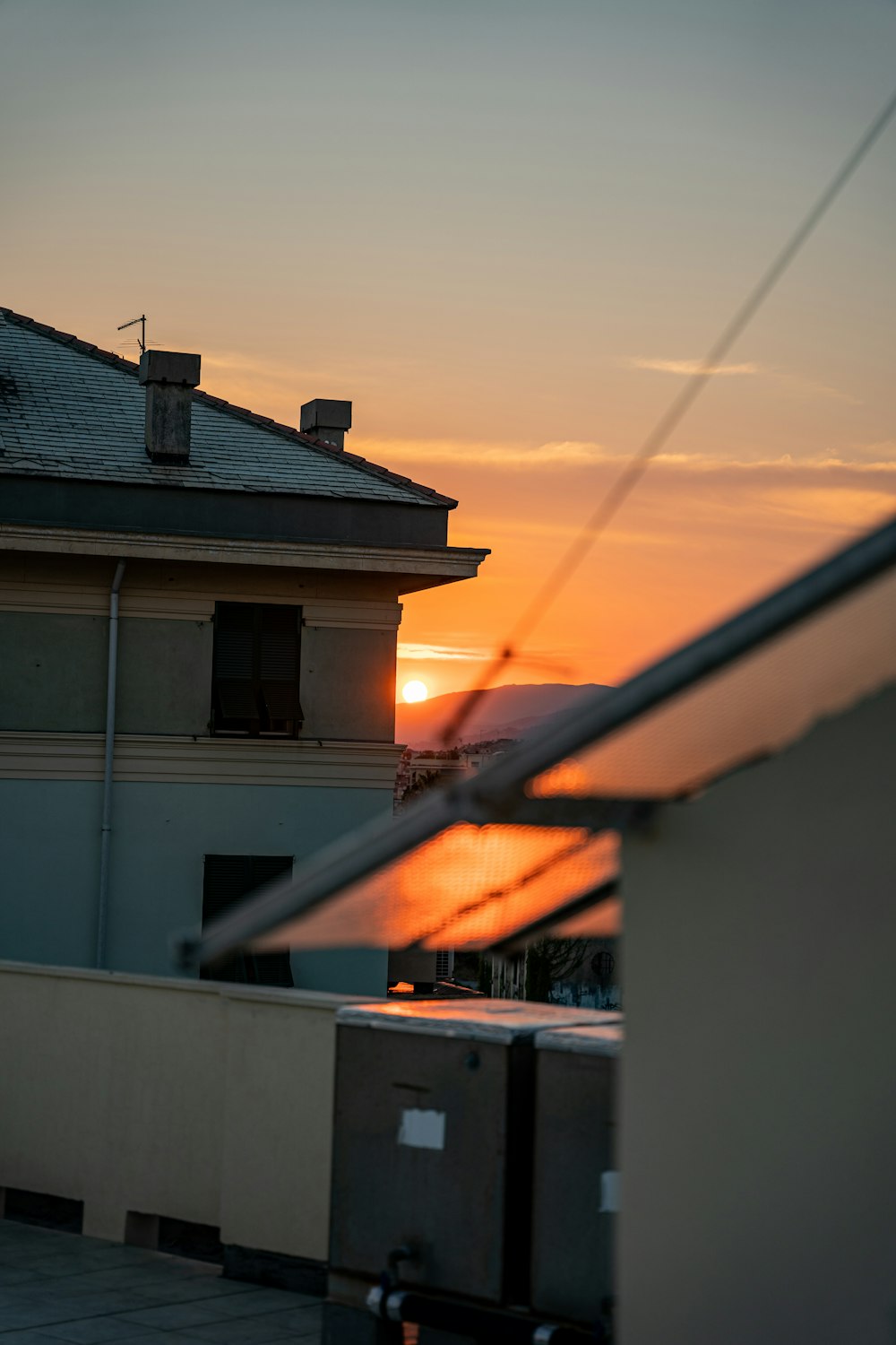 a sunset over a house