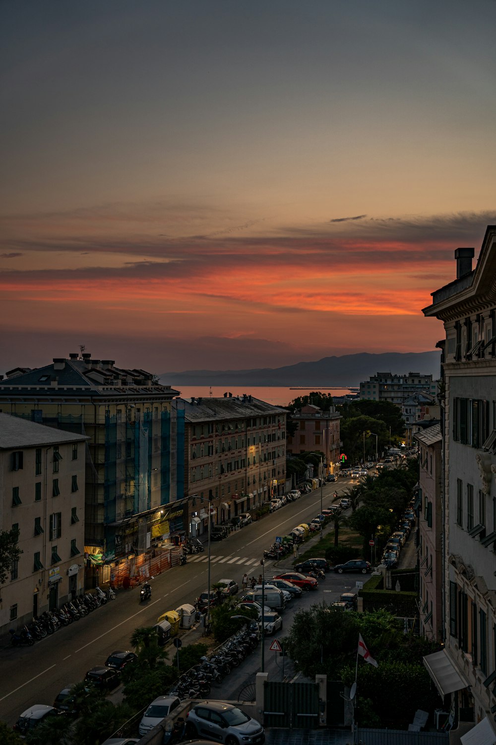 a city street with buildings and cars