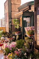a store front with flowers