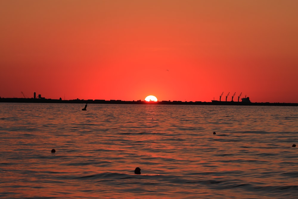 a sunset over a body of water