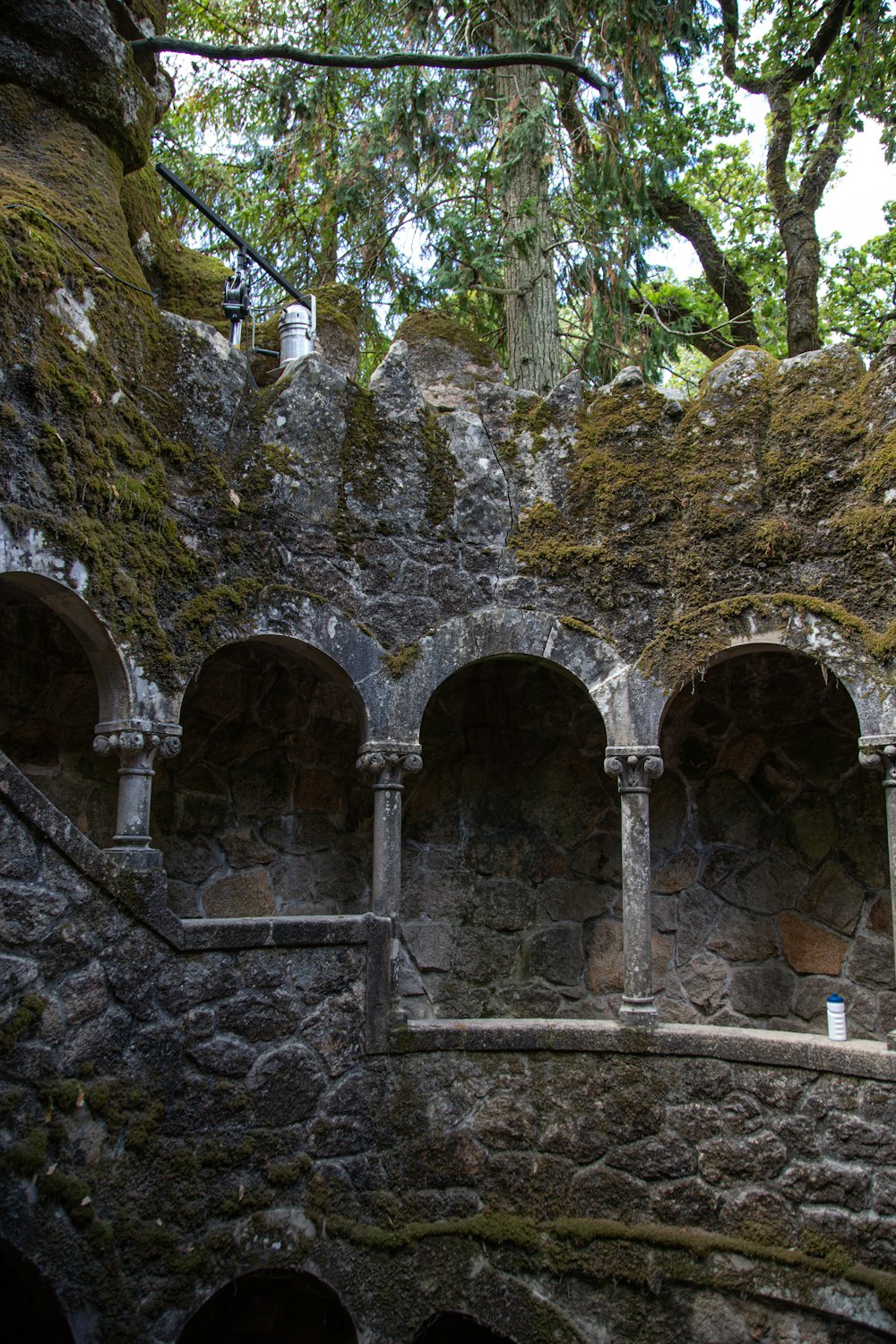 a stone wall with a stone arch