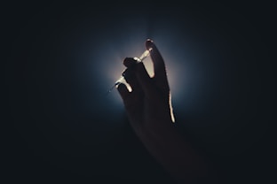 a person holding a light saber