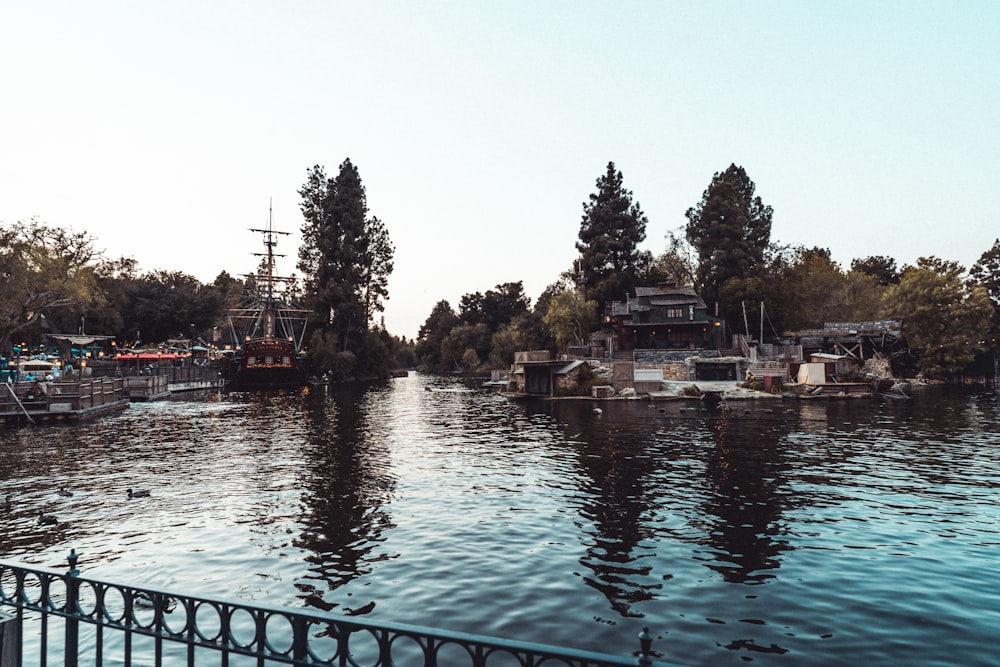 a body of water with boats and trees around it