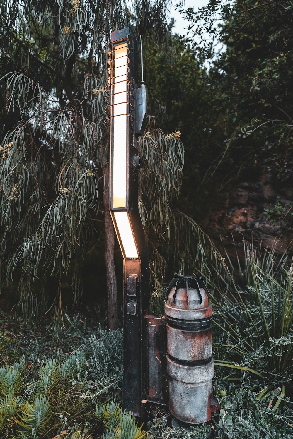 a wooden cross in a forest