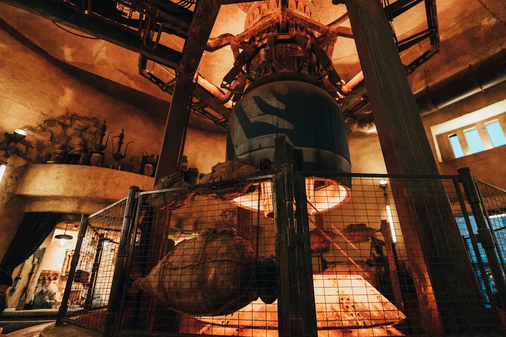 a large metal cage with birds inside