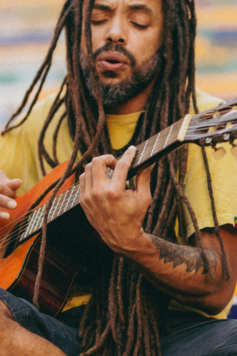 a man playing a guitar