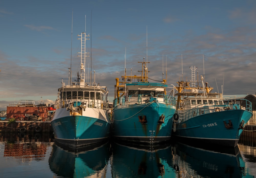 several boats docked at a pier