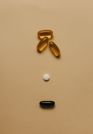 a group of pills or supplements on a surface