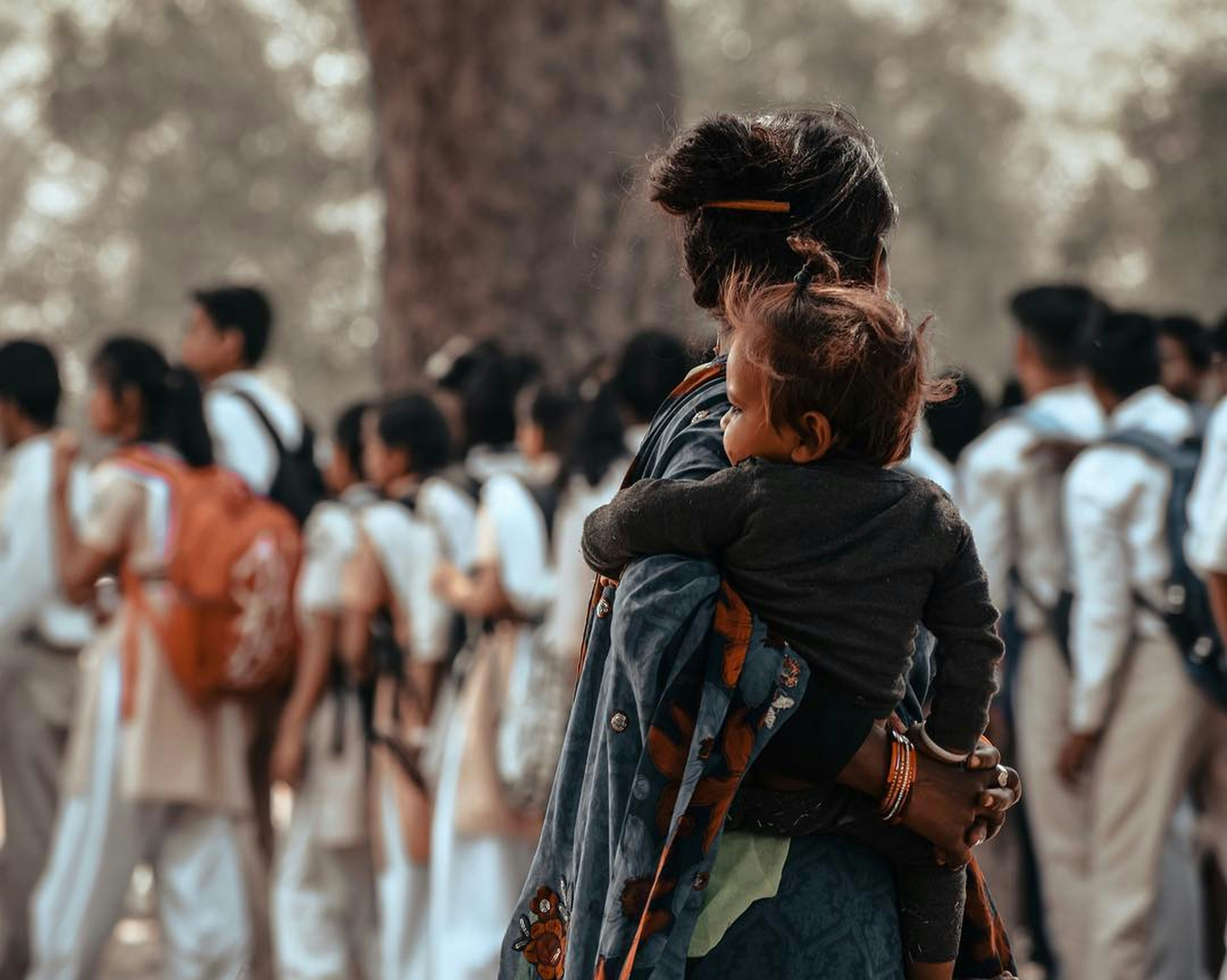 a person carrying a child