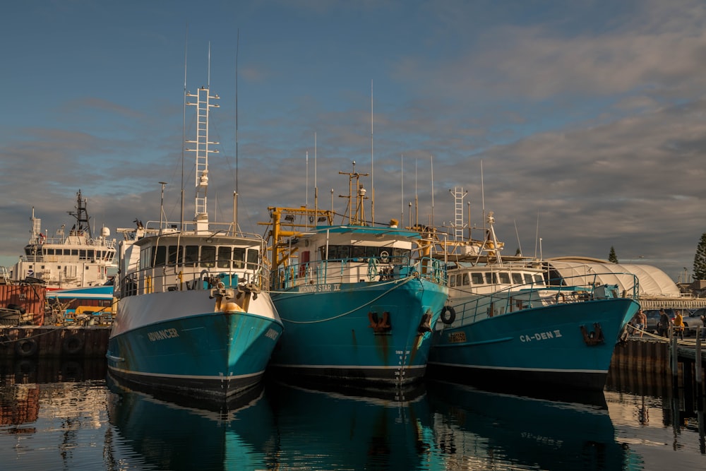 several boats docked at a pier