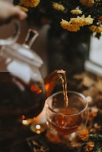 a glass of liquid being poured into a glass