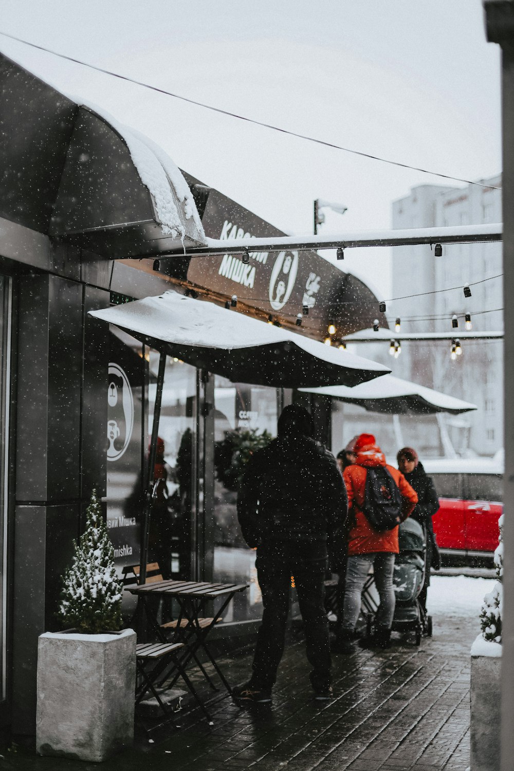 people walking under umbrellas