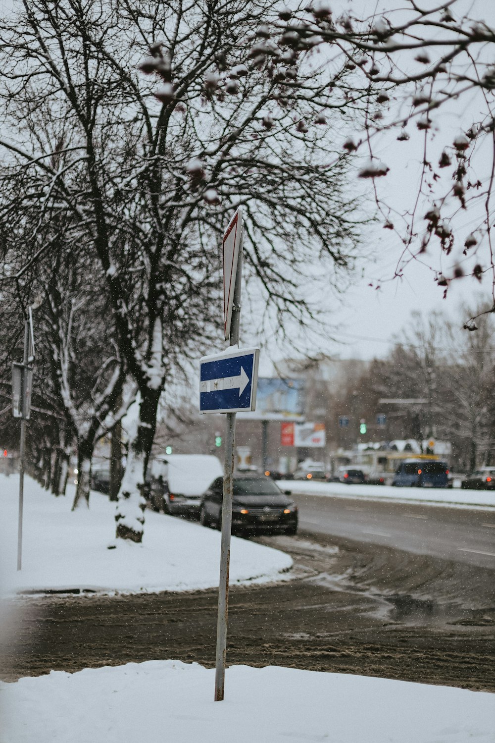 a street sign on a snowy street