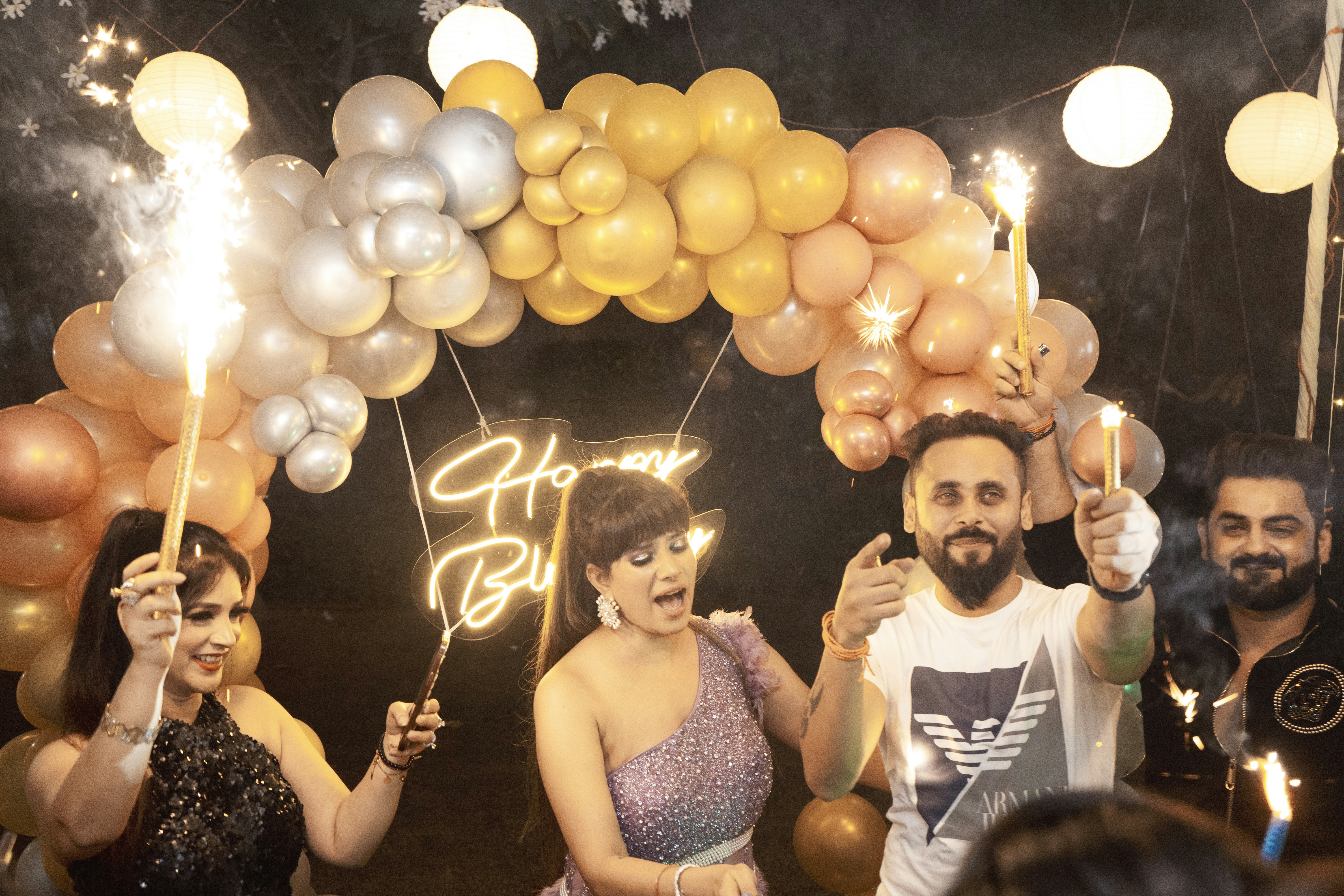 A group of friends celebrating a birthday with confetti