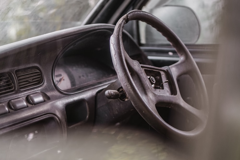 a steering wheel and dashboard of a car