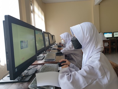 a couple of people working on computers