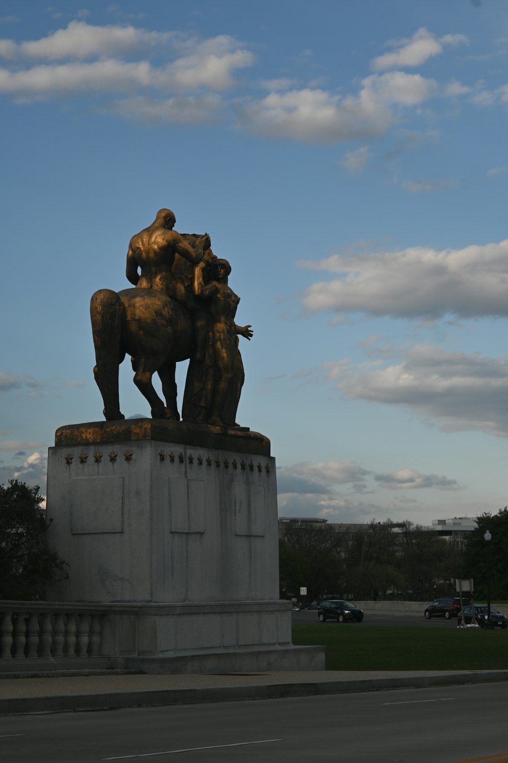 a statue of a person riding a horse