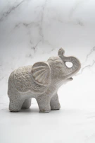 a small statue of a rhino