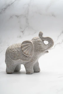 a small statue of a rhino
