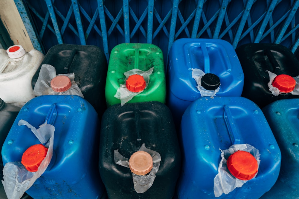 a group of blue plastic containers with red and white objects in them