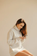 a woman looking at her phone