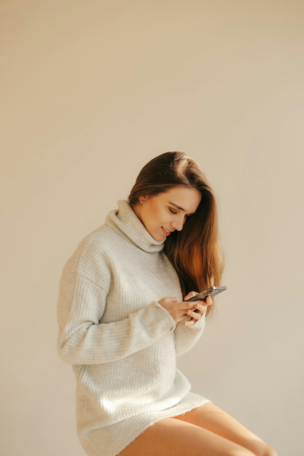 a woman looking at her phone