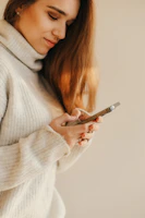 a person looking at the phone
