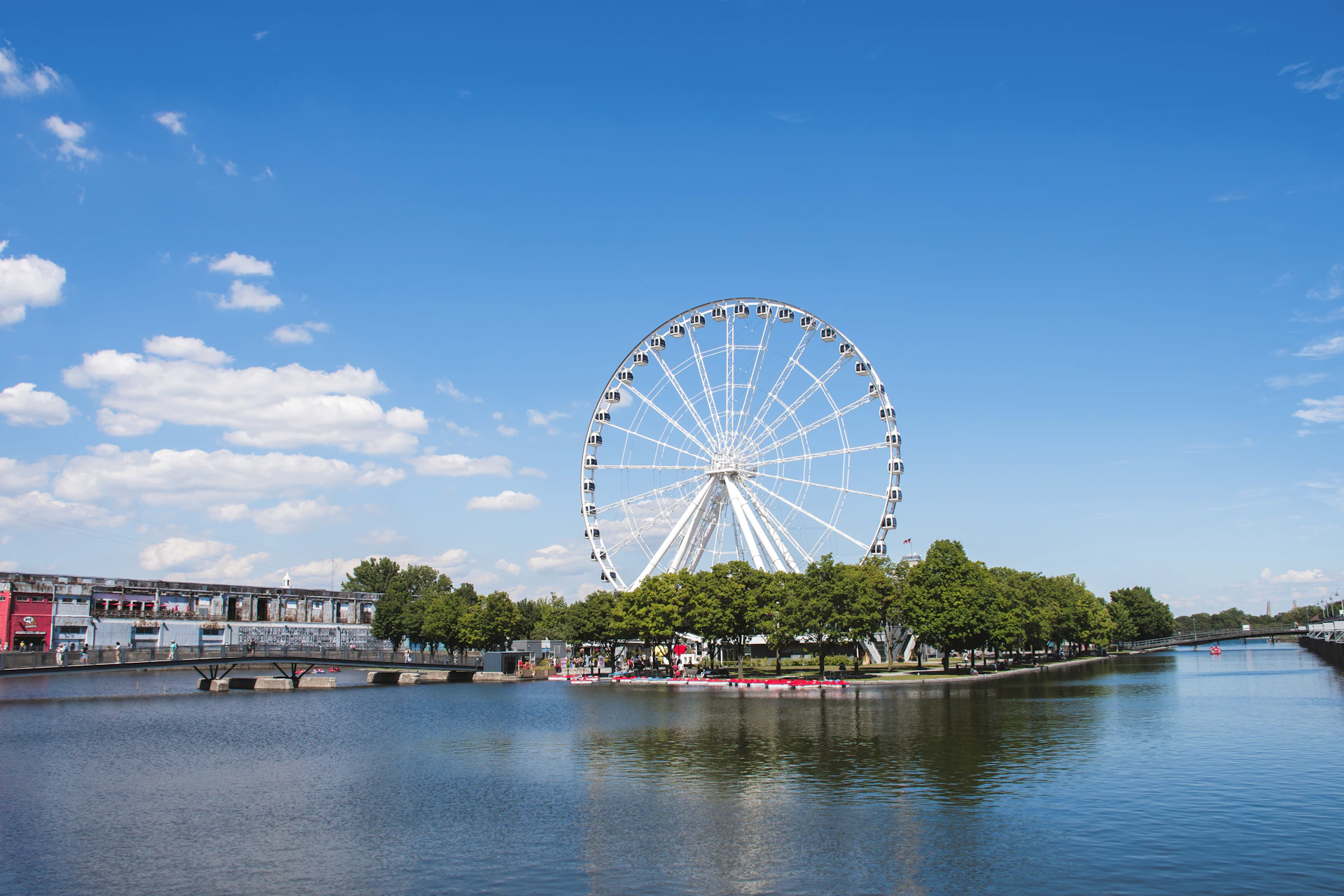 a ferris wheel by a river