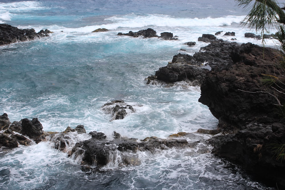 a rocky beach with waves crashing