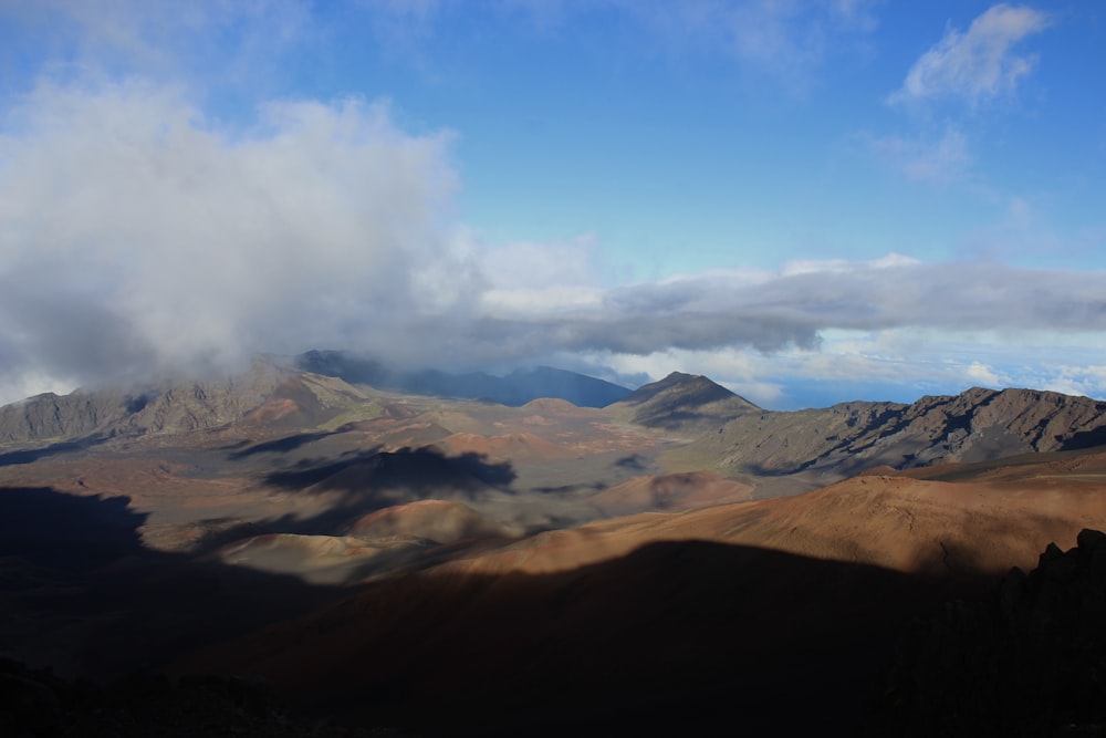 a landscape with mountains in the back