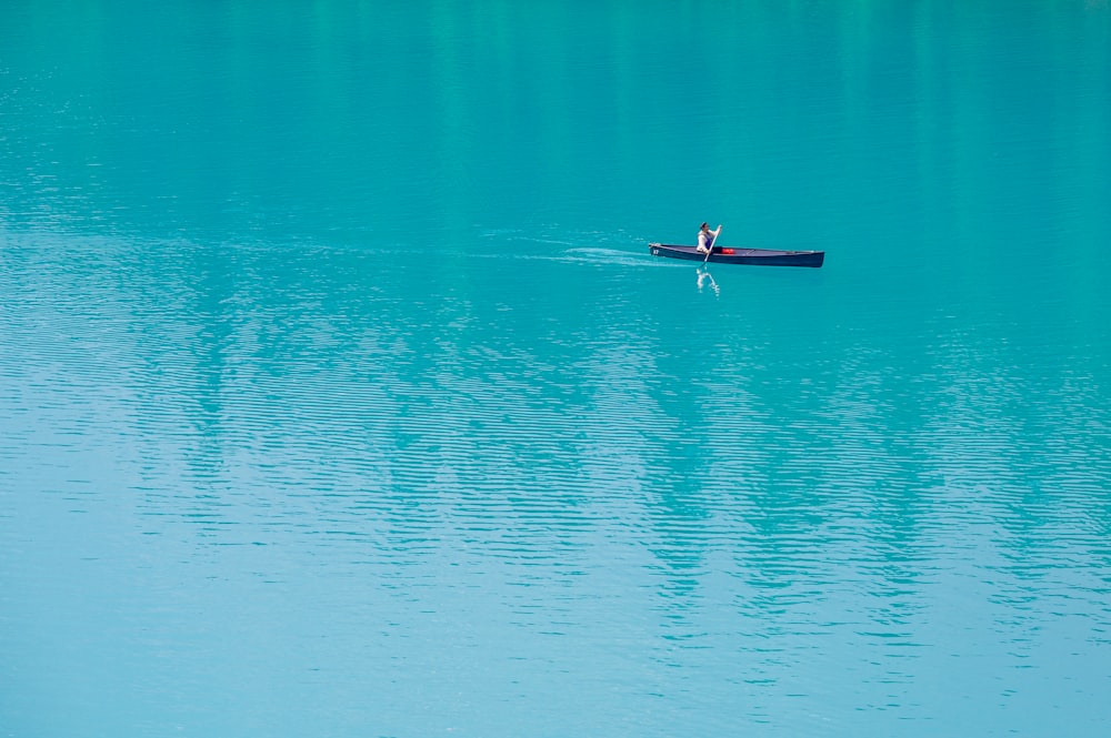 a person in a boat on the water