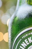 Close-up of a chilled Green Glow juice bottle with condensation on the glass.