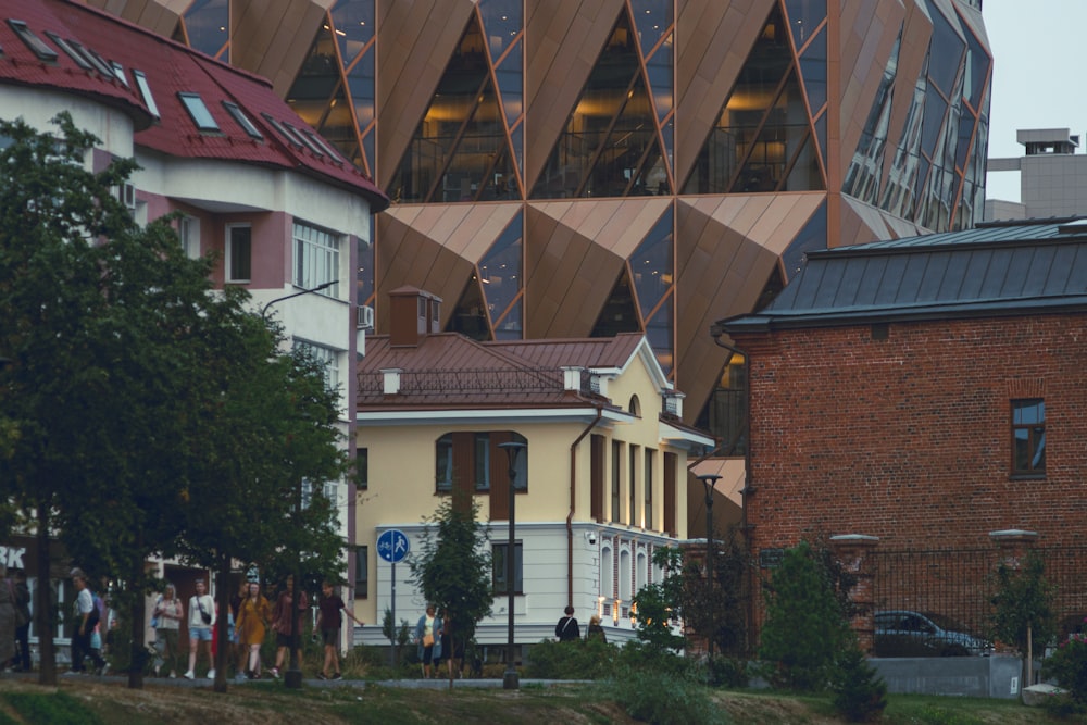 a group of people walking outside of a building