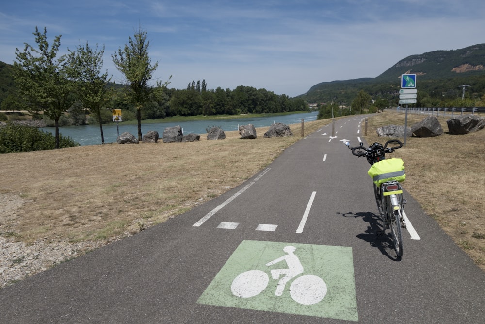 a bicycle parked on the side of a road