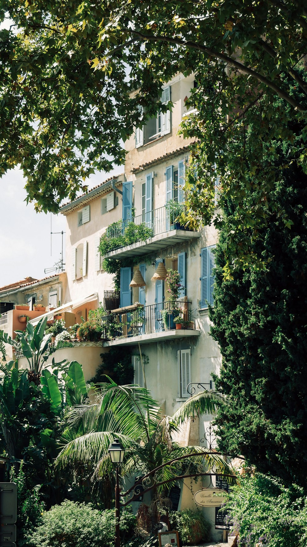 a building with trees and plants around it